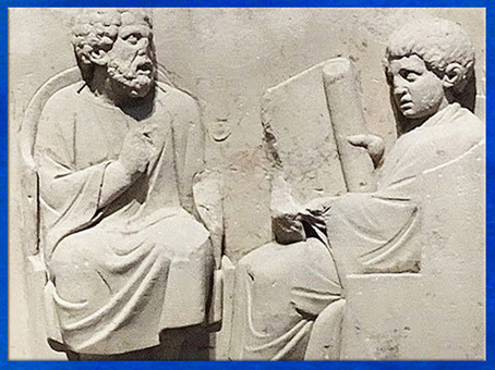 D'après un professeur et un étudiant, bas-relief de Neumagen, fin IIe siècle, grès, Allemagne, Trèves, période romaine. (Marsailly/Blogostelle)